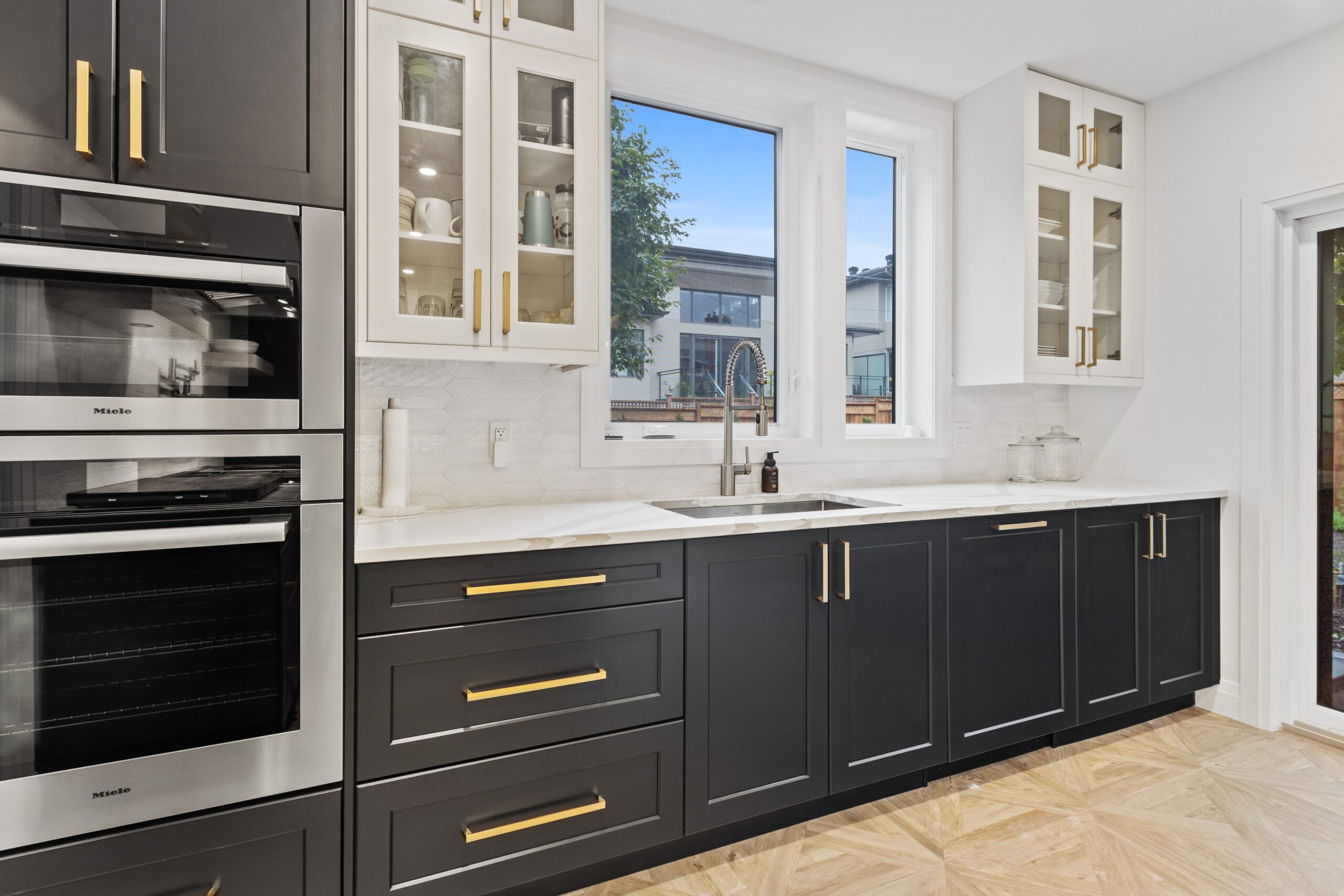 Expertly painted kitchen cabinets showcasing a flawless finish, adding a touch of elegance to the heart of the home.